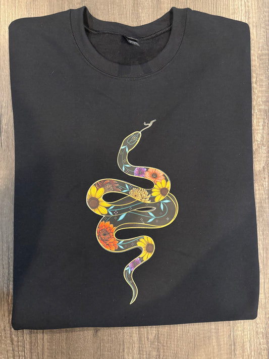 A black t-shirt with a printed snake design on the front.