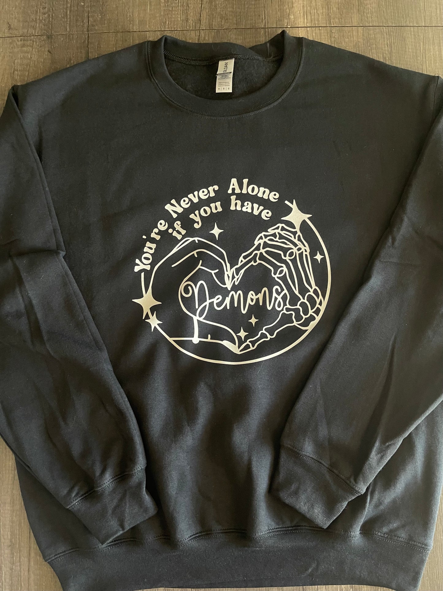 YOU'RE NEVER ALONE IF YOU HAVE DEMONS SHIRT