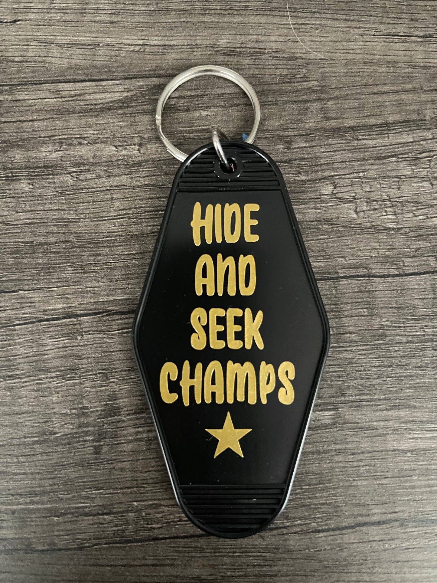 HIDE AND SEE CHAMPS KEYCHAIN